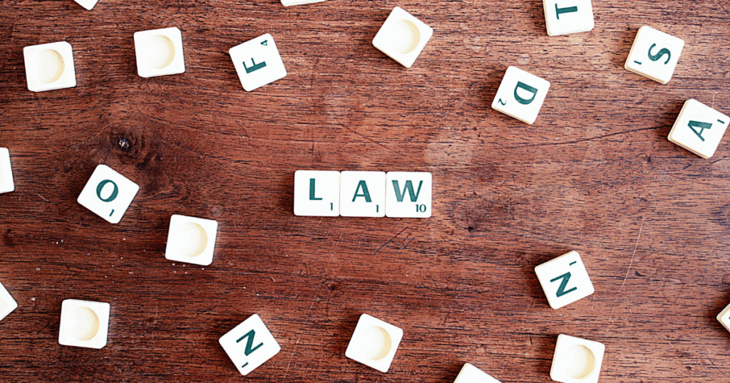 image | Clear Mind Treatment | Comprehensive Mental Healthcare Ketamine therapy legality concept: Scrabble tiles spelling "LAW" on wood, representing legal aspects of ketamine treatment.