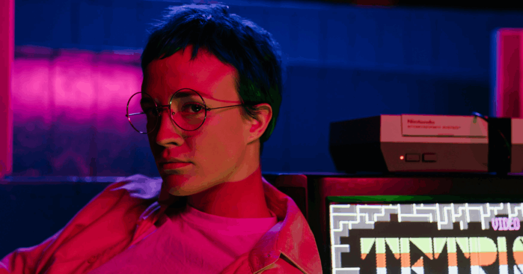 Ketamine effects on emotions: Retro gaming scene with person, glasses, Nintendo console, and Tetris on screen.